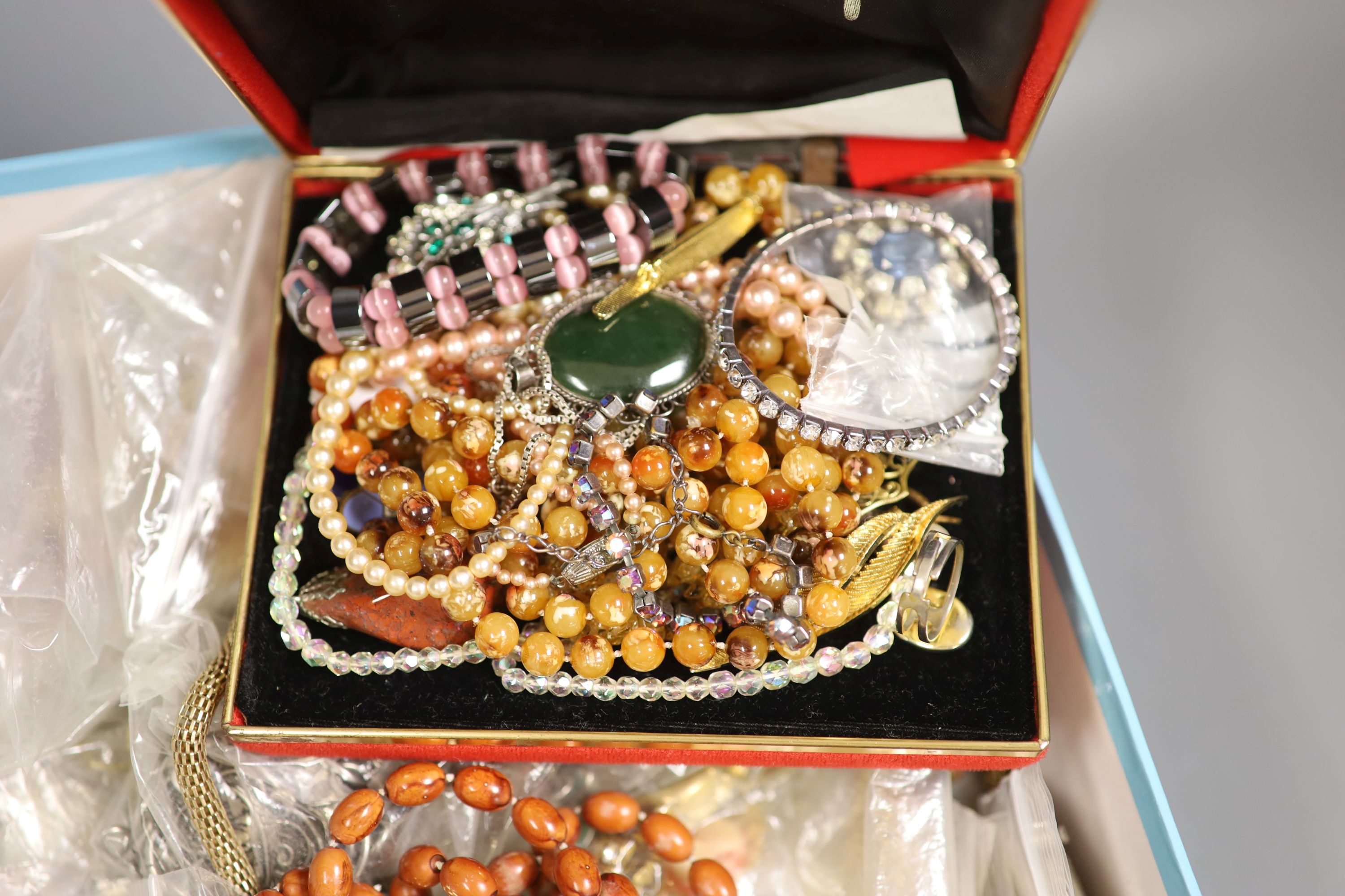 A box of assorted costume jewellery.